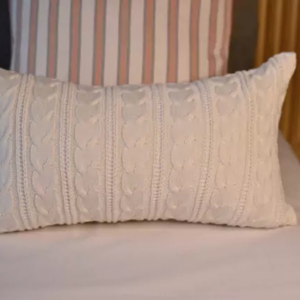 Almofada em tricot para deixar o ambiente mais aconchegante e sofisticado.