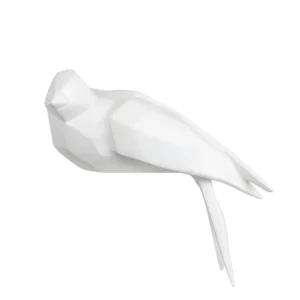 Escultura feita em resina no formato de pássaro. Adorno sofisticado e de traços geométricos foi criado para ser exposto do lado direito, se encaixando em superfícies como de mesas, estantes, prateleiras e livros. Desenvolvido e fabricado nacionalmente pela Modali Design.