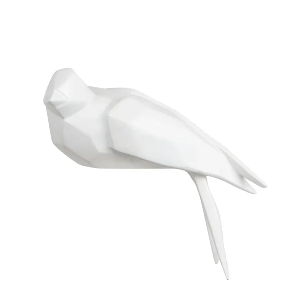 Escultura feita em resina no formato de pássaro. Adorno sofisticado e de traços geométricos foi criado para ser exposto do lado direito, se encaixando em superfícies como de mesas, estantes, prateleiras e livros. Desenvolvido e fabricado nacionalmente pela Modali Design.